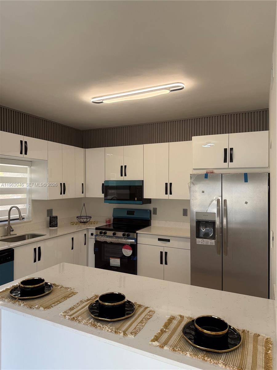 6793 SW 152nd PlMiami - WESTWIND LAKES GARDEN HOM condo unit 47-93 - picture